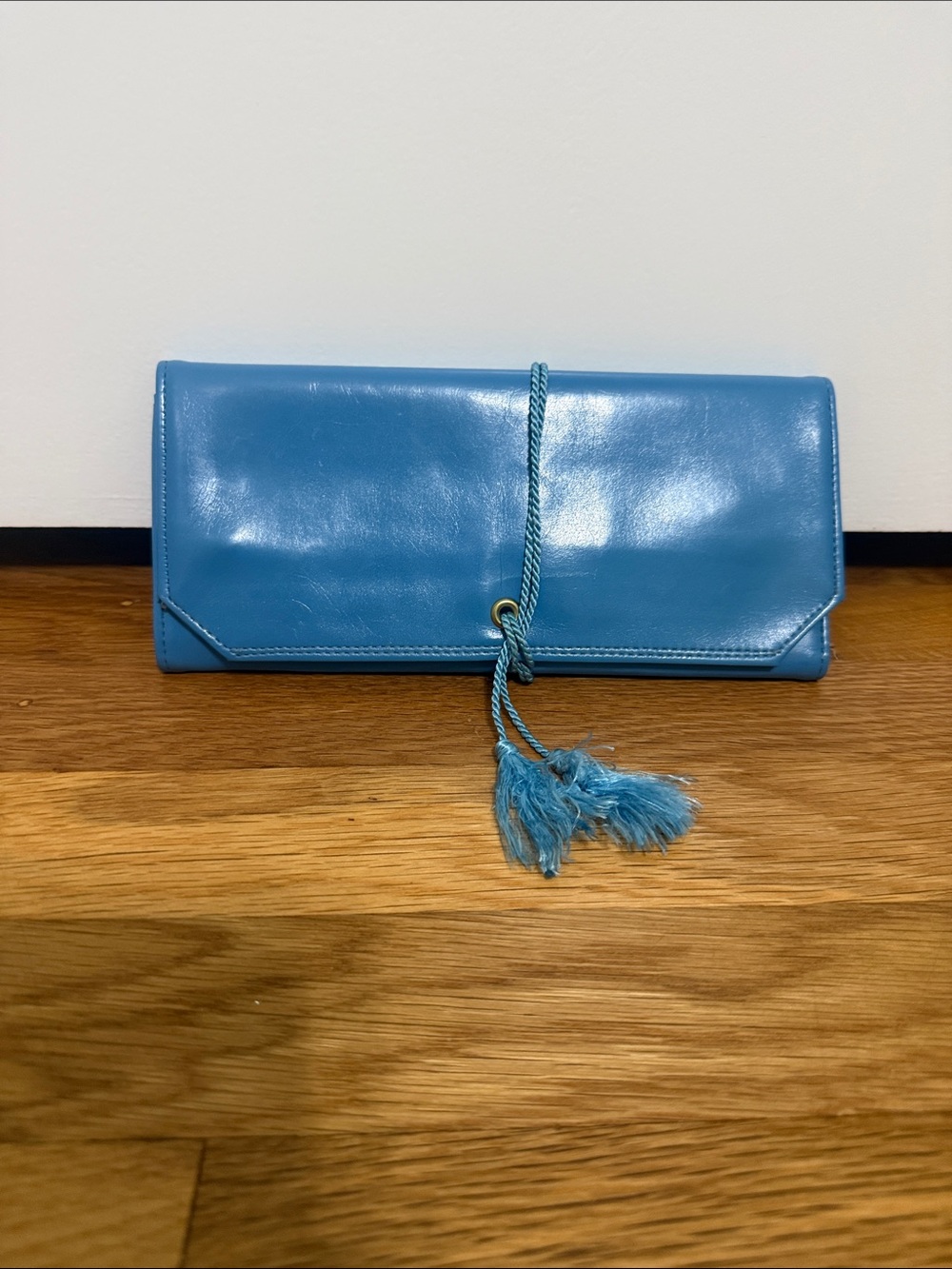 Rolfs Turquoise Leather Tassel Wrap Clutch